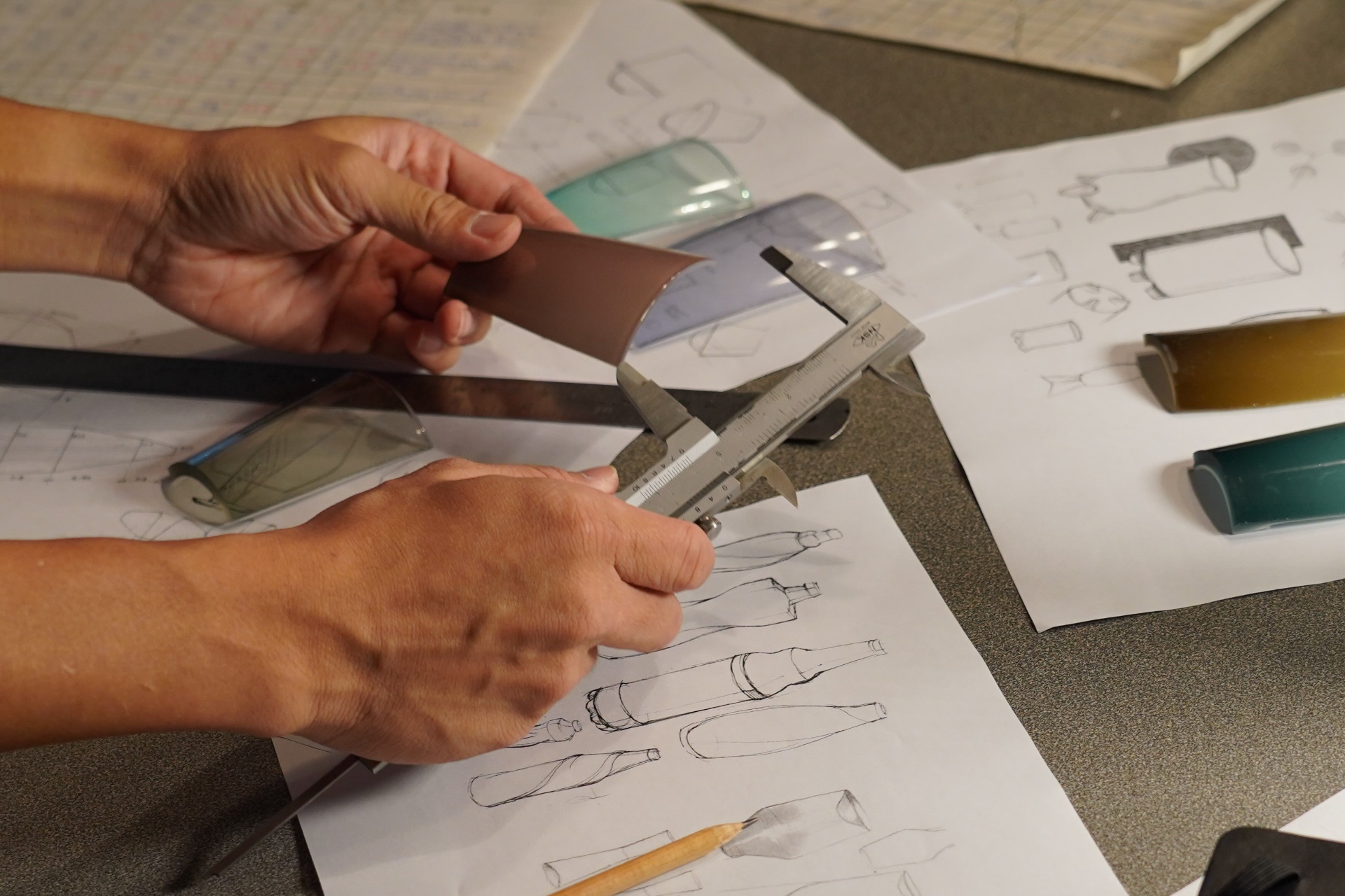 Designer sketching new glass forms